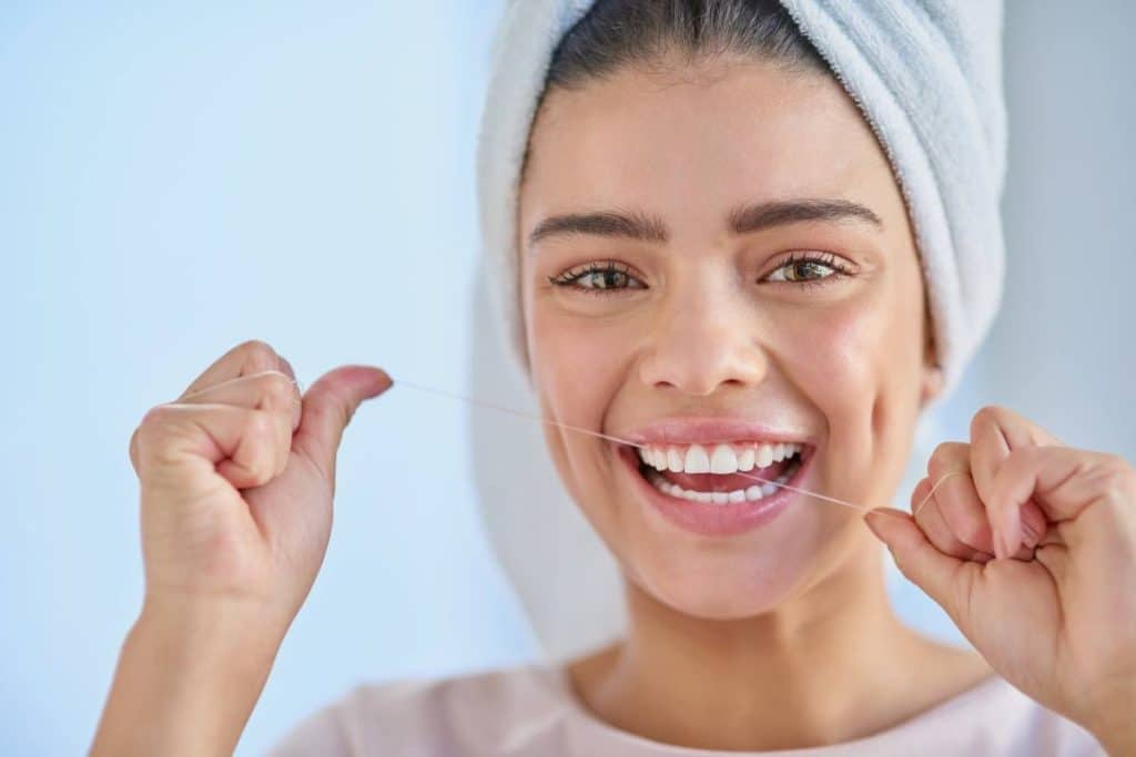 woman flossing